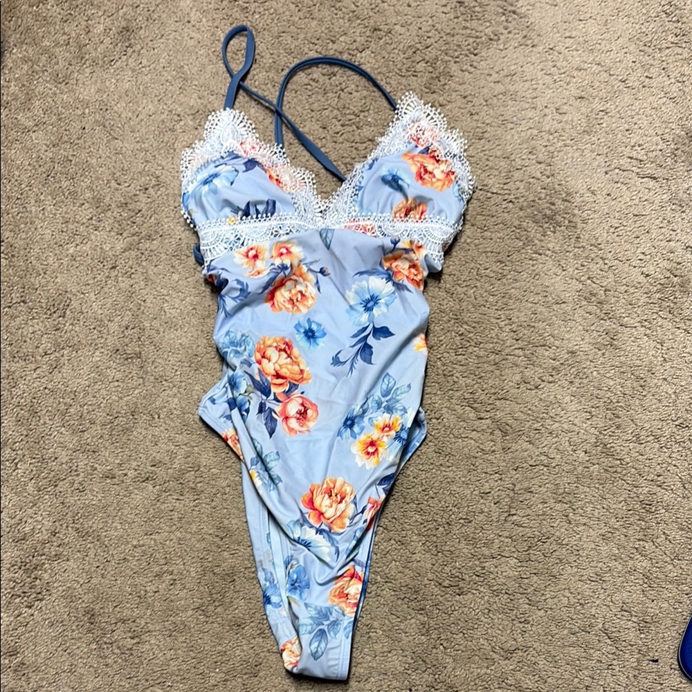Like new!  Only worn once! Blue Floral Lace Up Trim Back One-Piece Swimsuit